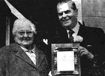 Library advocate Ada Dawe receiving a commemorative plaque from Premier W.A.C. Bennett at the dedication of Library improvements and of the archives, June 17, 1972. 