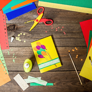 card making supplies on a wooden surface