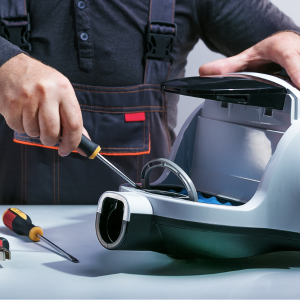 person repairing broken vacuum cleaner