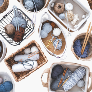 assortment of baskets with variety of needlework projects